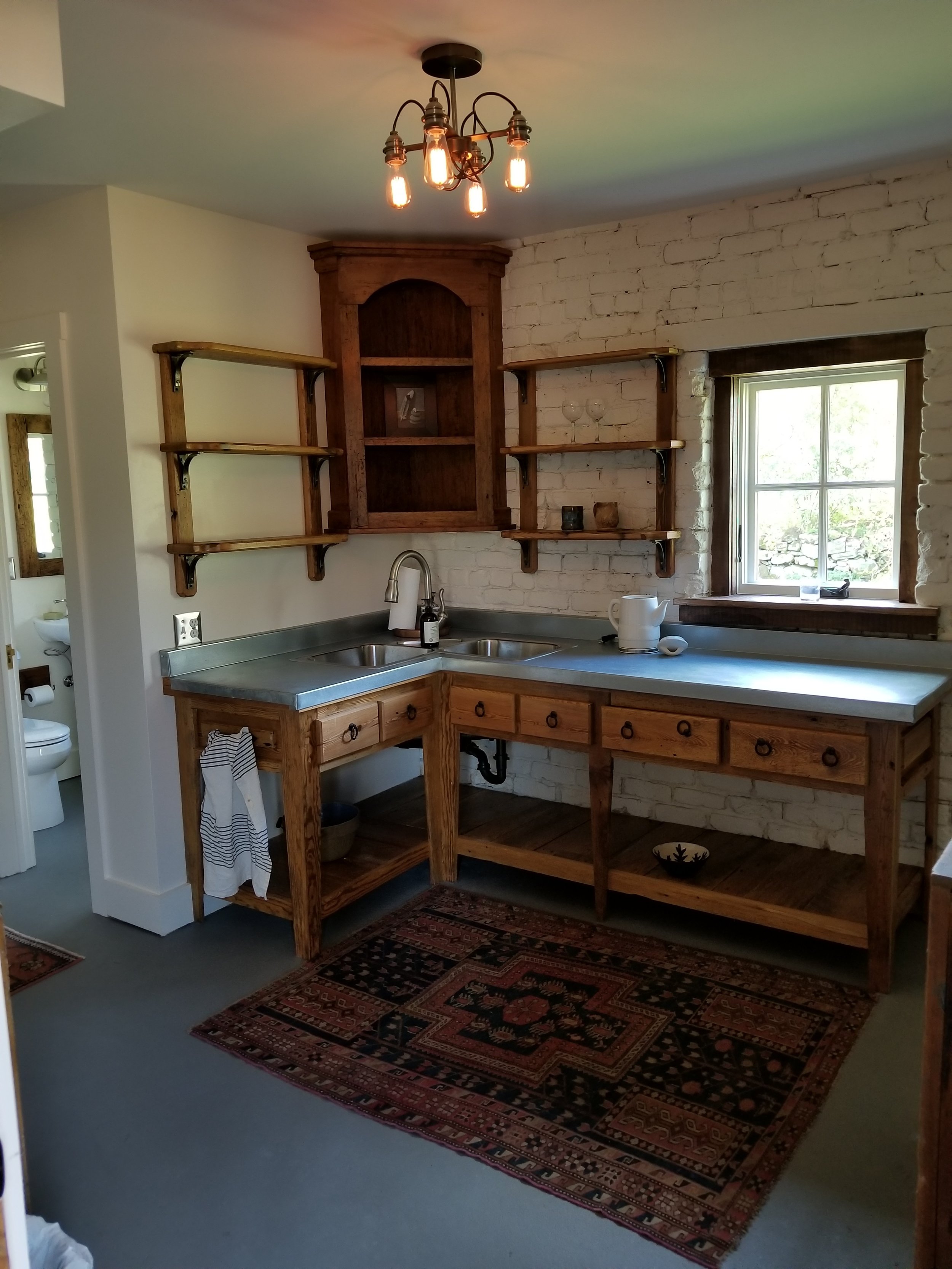 Kitchen renovation ...cabinetry from reclaimed site wood